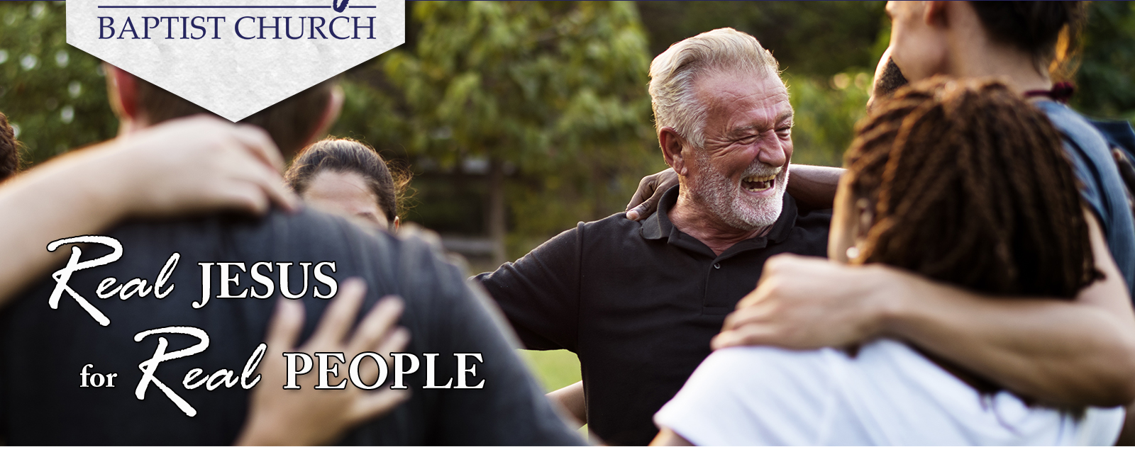 photo of smiling people outdoors with caption real Jesus for real people